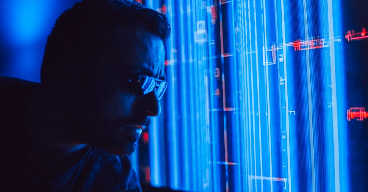 A wide-angle interior view of a modern financial data operations center, rows of dark monitors and glowing blue interface panels, cool cinematic lighting, no visible writing or sign, professional and calm atmosphere