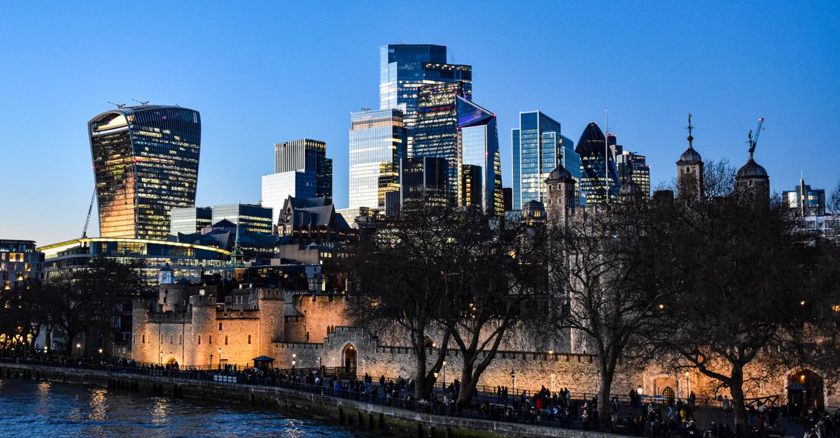 A wide-angle cinematic view of a modern London government district at dusk, historic stone buildings and glass office towers, overcast sky, calm documentary atmosphere, no visible writing or sign, no people in focus